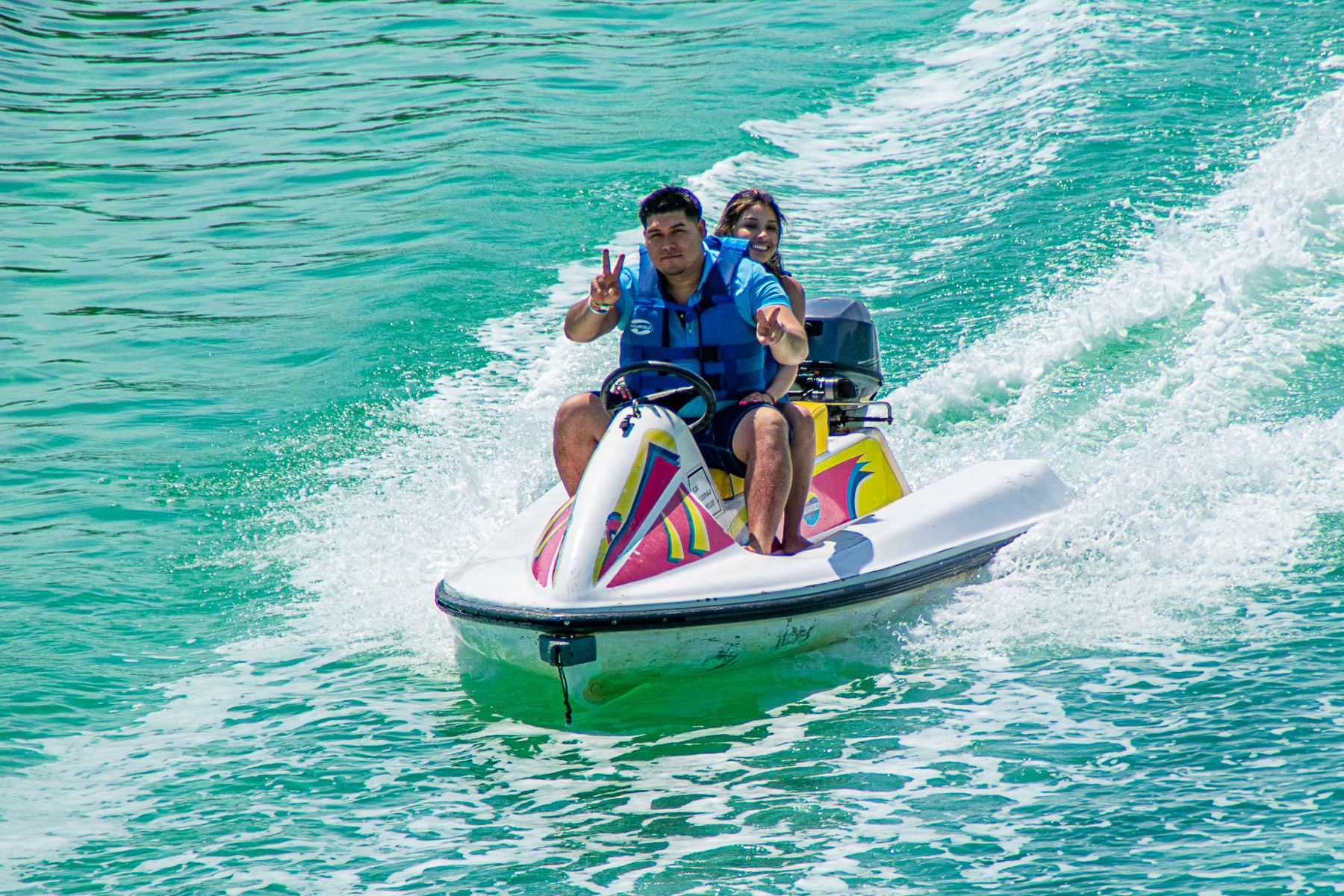 A couple of people on a JetSky doing the signature tour in Cancun, The Jungle Tour