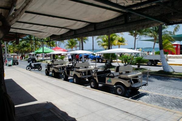 Several Golf Carts lined and ready to be rented in Isla Mujeres, Mexico