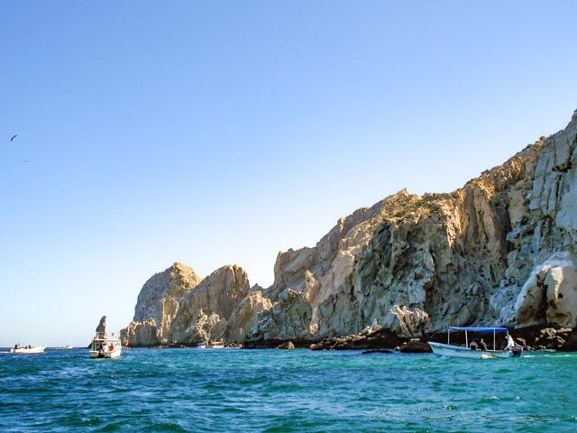 Boats filled of tourists while snorkeling at Los Cabos
