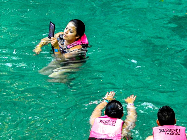 A girl taking a selfie at Xcaret Water Park in Playa del Carmen, Mexico
